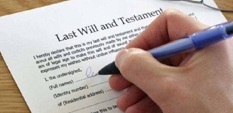 hand signing with pen last will and testament